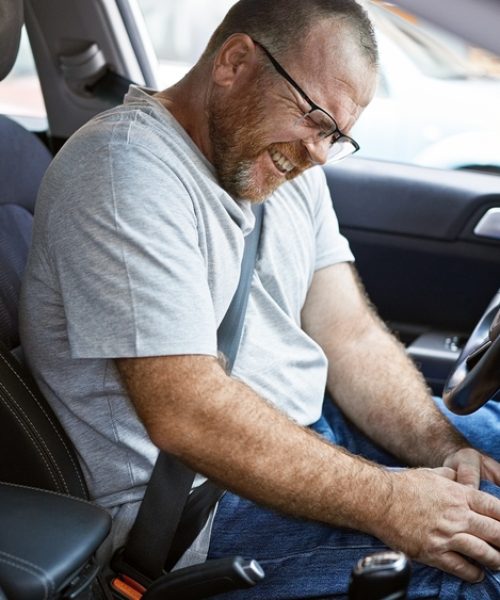 Stressed,Caucasian,Man,In,Glasses,,Sitting,In,Car,On,City